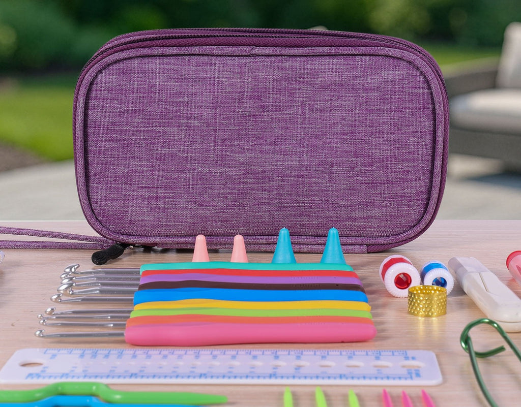 Crochet kit contents including ergonomic hooks, stitch markers, ruler, and yarn needles, with a purple storage case in the background.