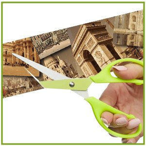 Hand holding green scissors cutting a collage of European landmarks