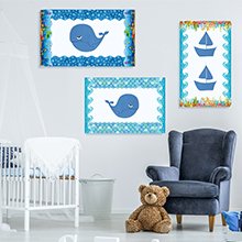 Nursery wall decor with three framed nautical-themed prints: two with whales and one with sailboats.