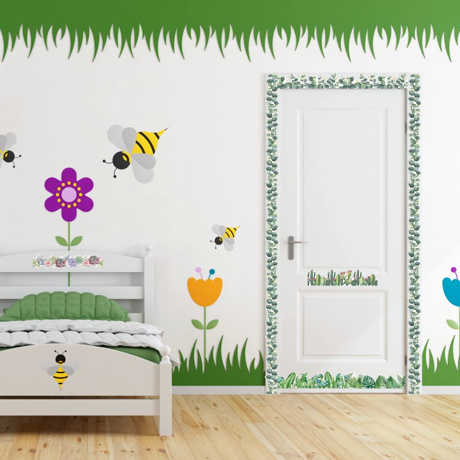Bedroom decorated with green eucalyptus bulletin board border trim around a door and wall decals of bees and flowers.