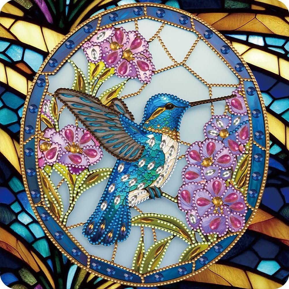 Diamond painting kit featuring a blue hummingbird surrounded by purple flowers and green leaves, set within a stained-glass-like border.