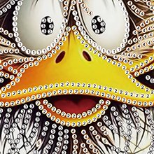 Close-up of a diamond art kit featuring a cartoon duck face with large eyes and a yellow beak, partially completed with numbered rhinestones.