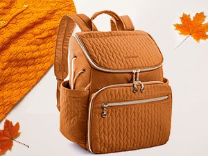 Quilted brown knitting backpack with multiple pockets and grommets, shown with a knitted sweater and autumn leaves.