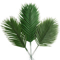 Three artificial palm leaves with stems, varying sizes, on a white background.