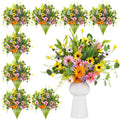 Bundle of artificial daisy wildflowers in a white vase, with multiple bouquets arranged on the left.
