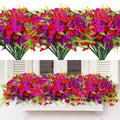 Artificial petunia and fern flowers in red, pink, and purple arranged in a window box and as separate bundles.