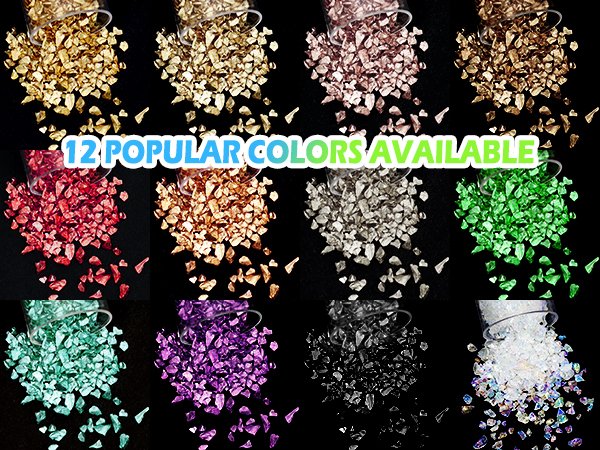 Twelve colors of crushed glass glitter chips spilling from jars against a black background.