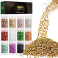 Twelve small jars of crushed glass glitter in various colors, with a pile of gold glitter spilling from a jar.