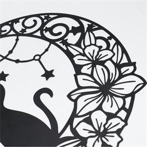 Black metal moon cat wall decor with floral and star accents, close-up detail.