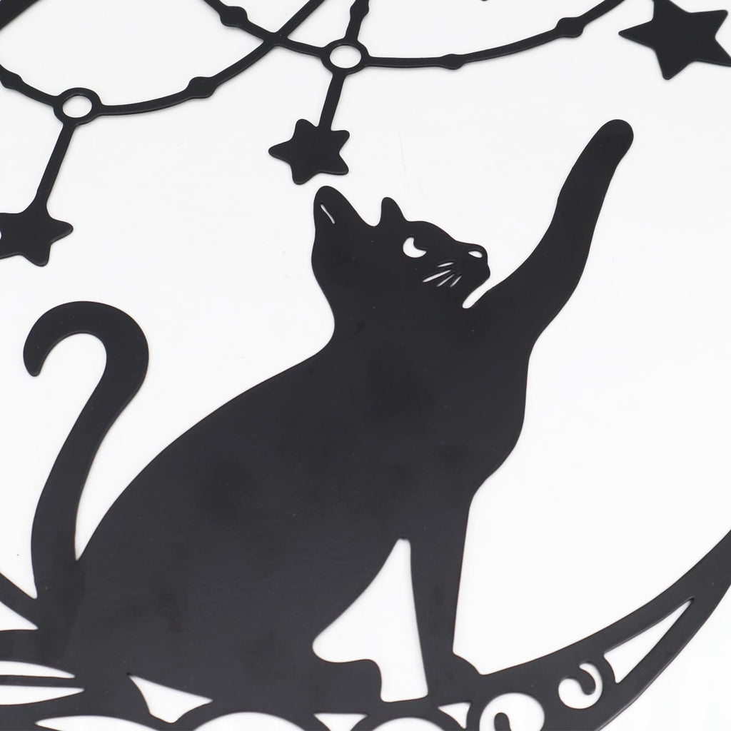 Black metal moon cat wall decor with stars and celestial elements, close-up detail.