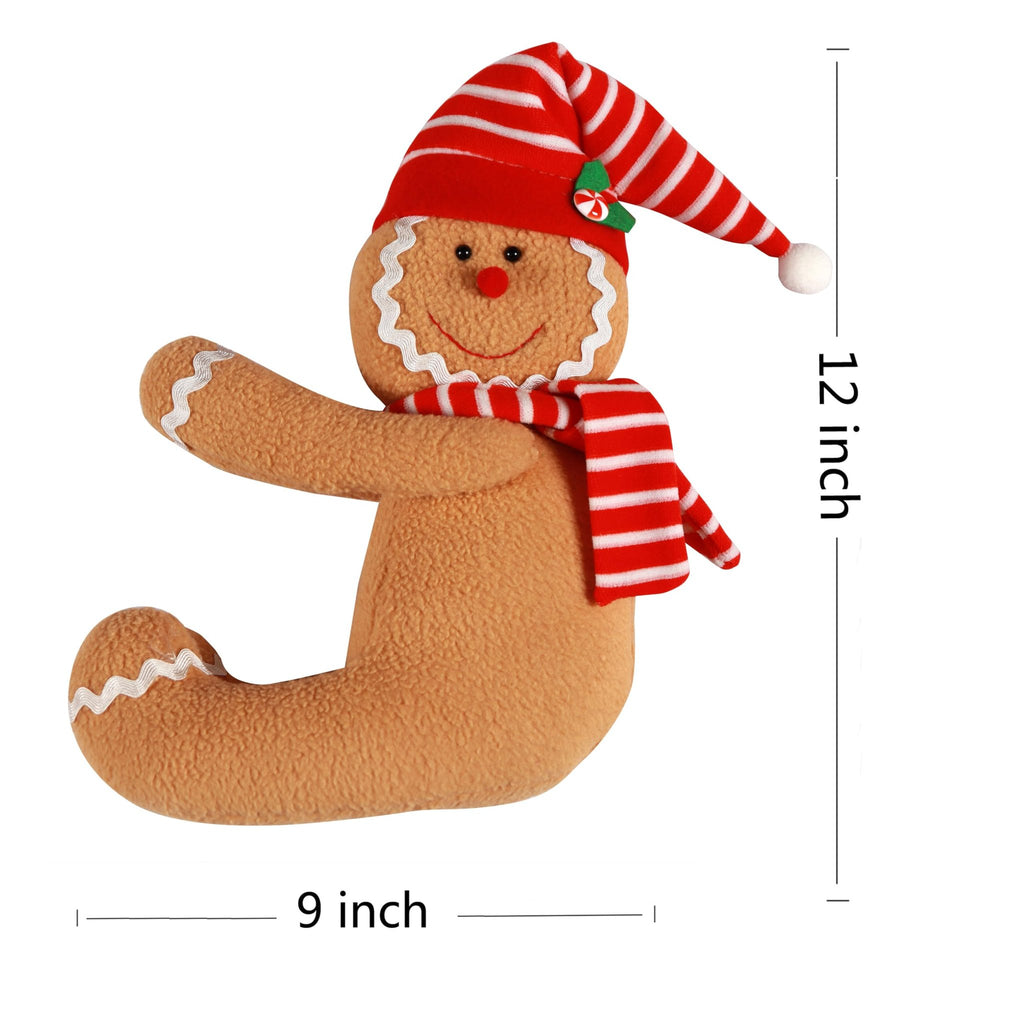 Plush gingerbread man Christmas tree topper with red and white striped hat and scarf, shown from the side.