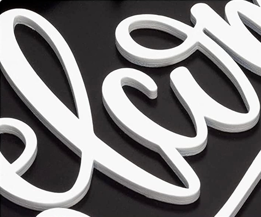 Close-up of white 3D layered script text spelling 'Welcome' on a black background.