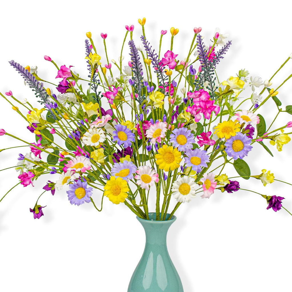 Artificial spring floral arrangement with daisies, wildflowers, and pip berries in a teal vase.