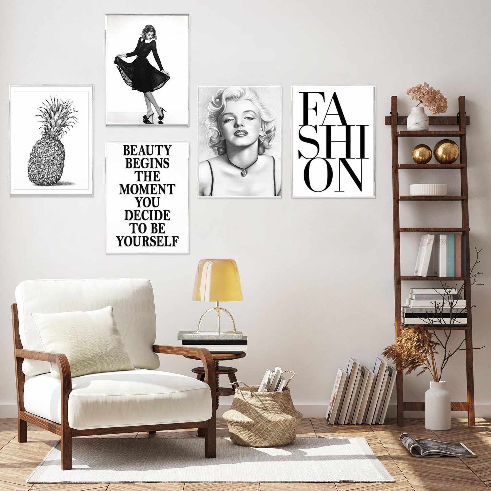 Living room scene with five framed art prints on the wall, a white armchair, and a wooden ladder shelf.