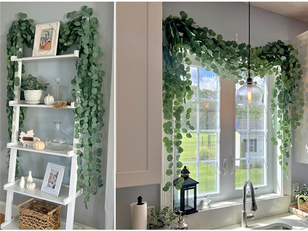 Artificial eucalyptus garland draped on a shelf unit and across a kitchen window, showcasing home decor.