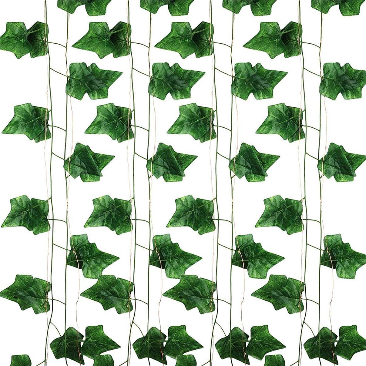 Artificial ivy vine garland with green leaves and thin string lights against a white background.