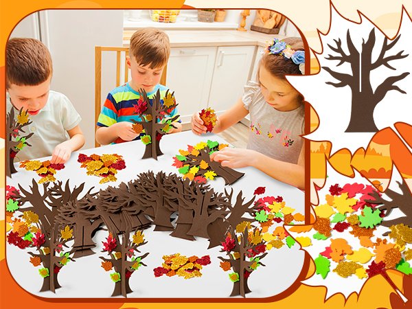 Children crafting fall trees with glitter maple leaf stickers on a white table