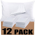12 white microfiber pillowcases stacked on a cardboard box, one pillowcase is open.
