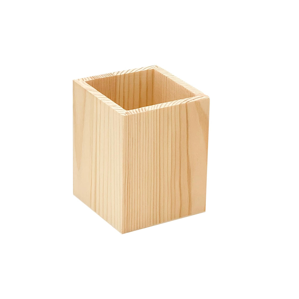 Unfinished pine wood pen holder shown from a three-quarter angle against a white background.