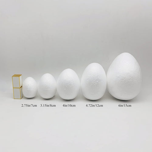 Five white polystyrene foam eggs of varying sizes displayed with size labels below them.