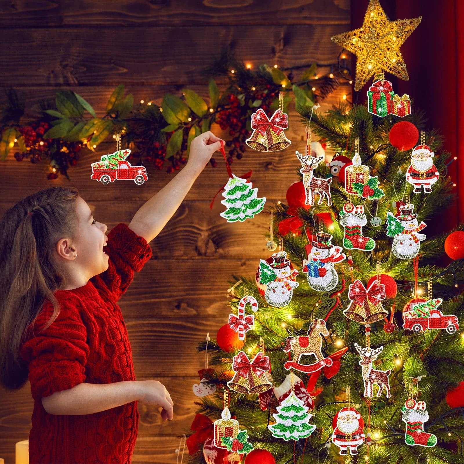 Young girl hanging a diamond art Christmas ornament keychain on a decorated tree. Ornaments include Santa, snowman, reindeer, truck, bells, and tree.