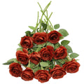 A bouquet of 12 burnt orange artificial silk roses with green leaves and stems, arranged on a white background.