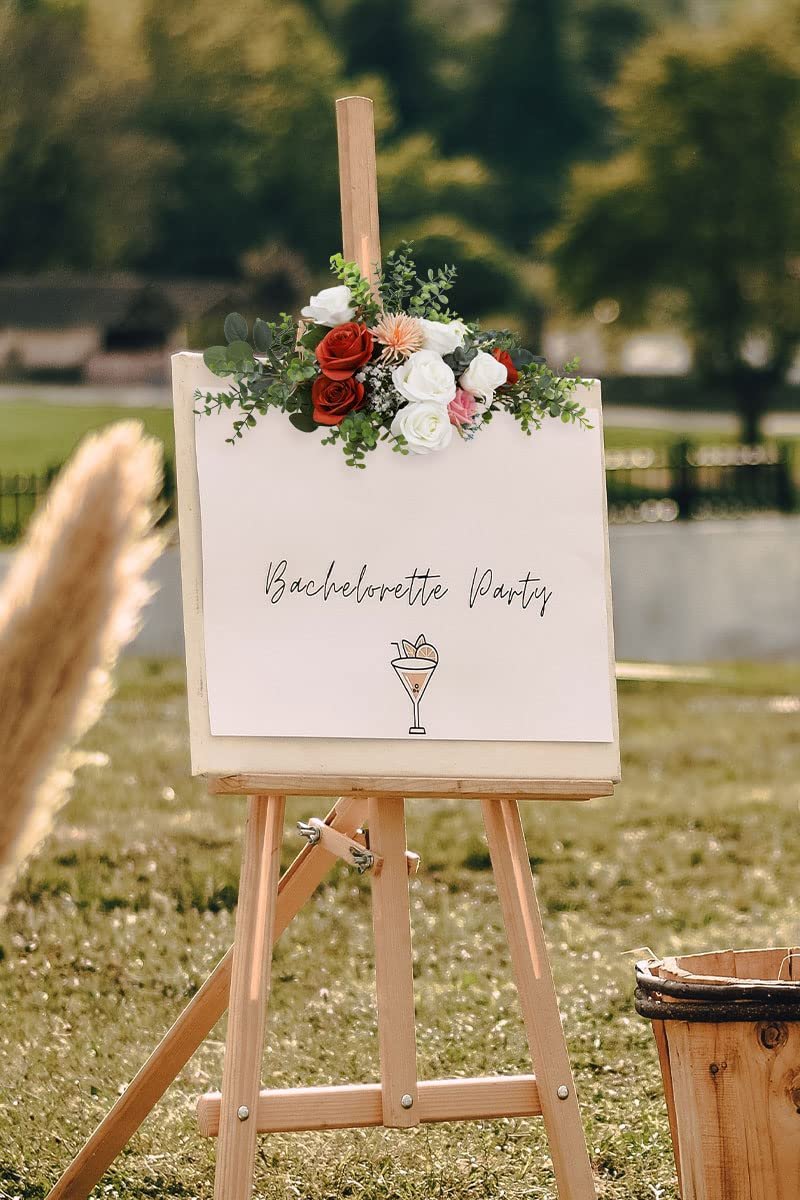 Artificial silk roses and greenery arranged on an easel with a sign that says Bachelorette Party