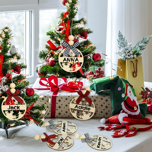Christmas tree with wooden name tags hanging, featuring names like Jack, Anna, Addie, Jon, Allen, and Kevin.