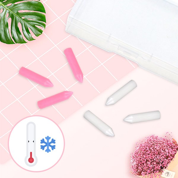 Pink and white diamond painting wax refills scattered on a pink grid background with a storage box, tropical leaf, and pink flowers.