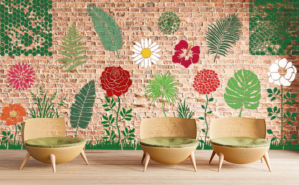Floral and leaf stencils displayed on a brick wall behind three chairs
