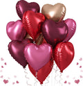 Bunch of 12 heart-shaped foil balloons in various shades of red, pink, and rose gold, with curling ribbons.