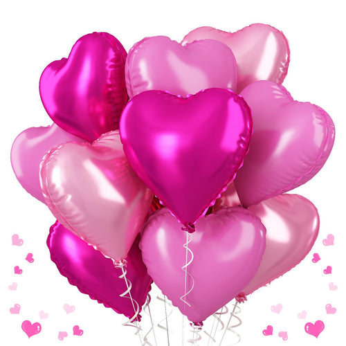 A bouquet of pink and magenta heart-shaped foil balloons with white ribbons against a white background.