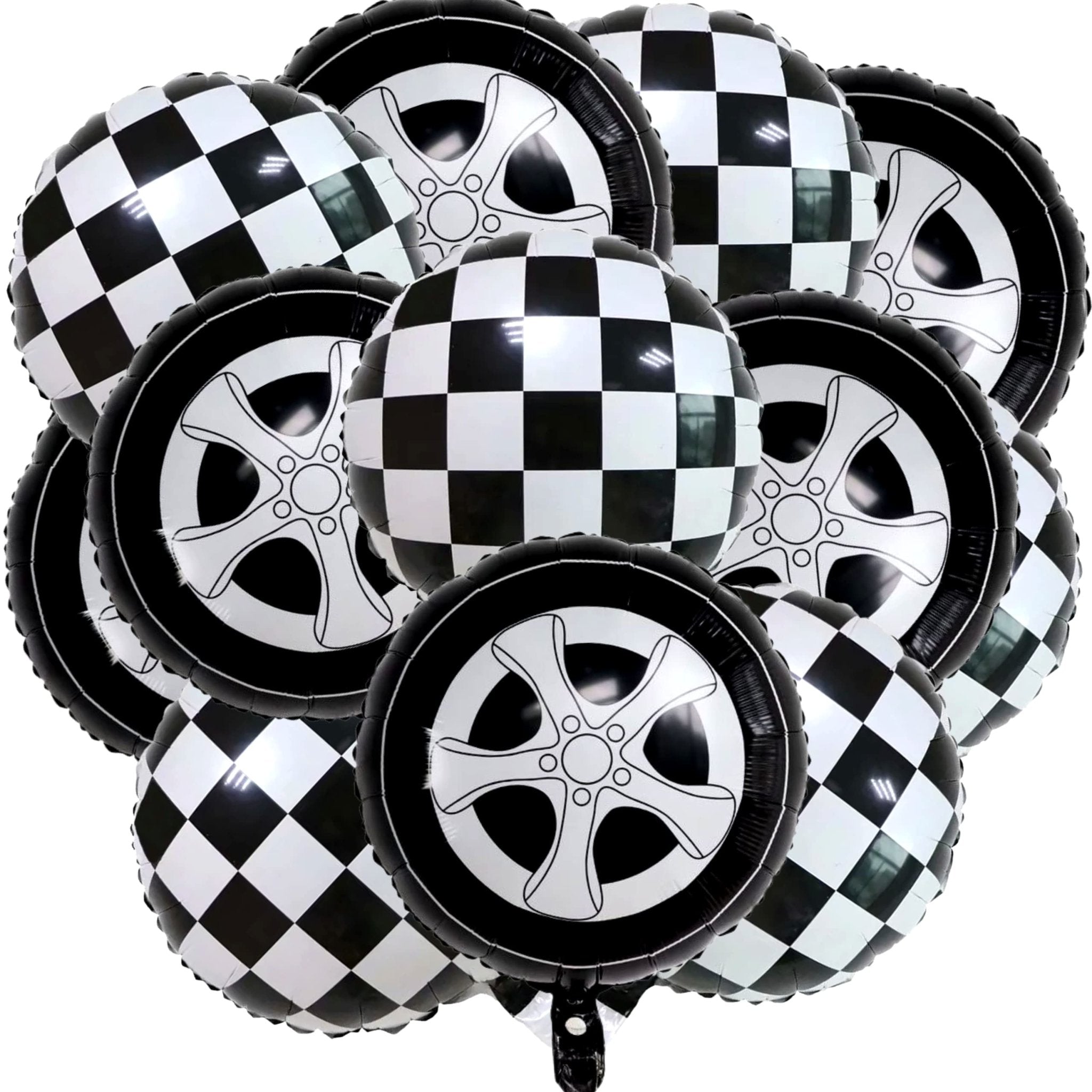 Pile of race car themed foil balloons, some with checkered patterns and others designed as car wheels.