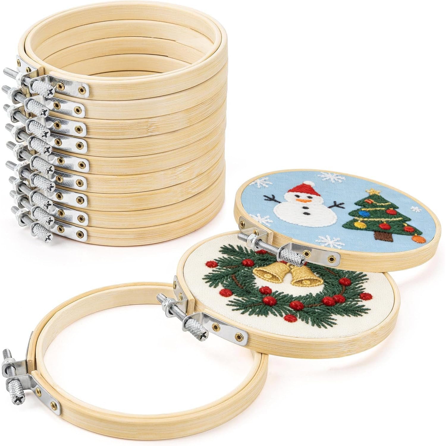Stack of 12 bamboo embroidery hoops with two hoops showing Christmas designs in the foreground