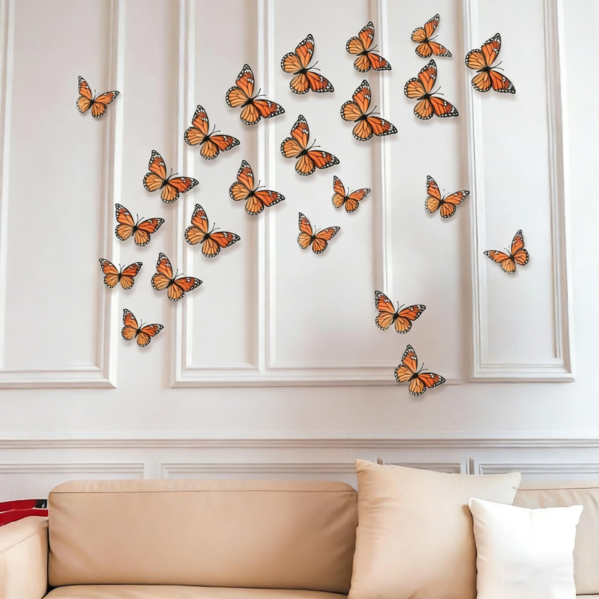 Monarch butterflies wall decor arranged on a white paneled wall above a sofa