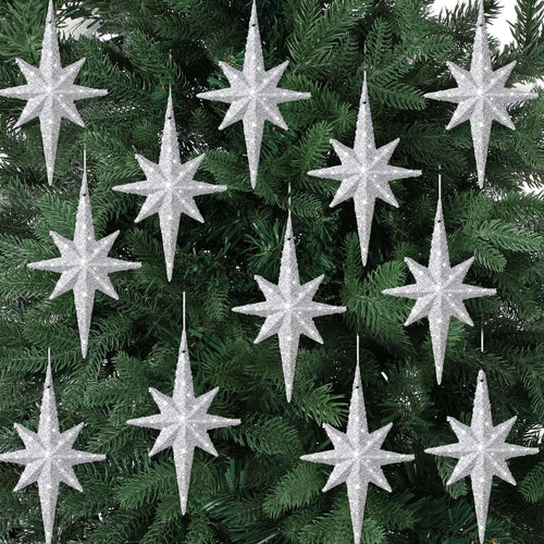 Twelve silver glitter Bethlehem star ornaments hanging on a green Christmas tree