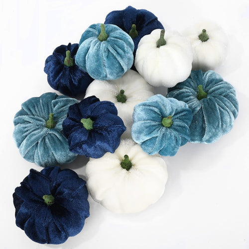 A collection of 12 velvet artificial pumpkins in various shades of blue and white, arranged on a white background.
