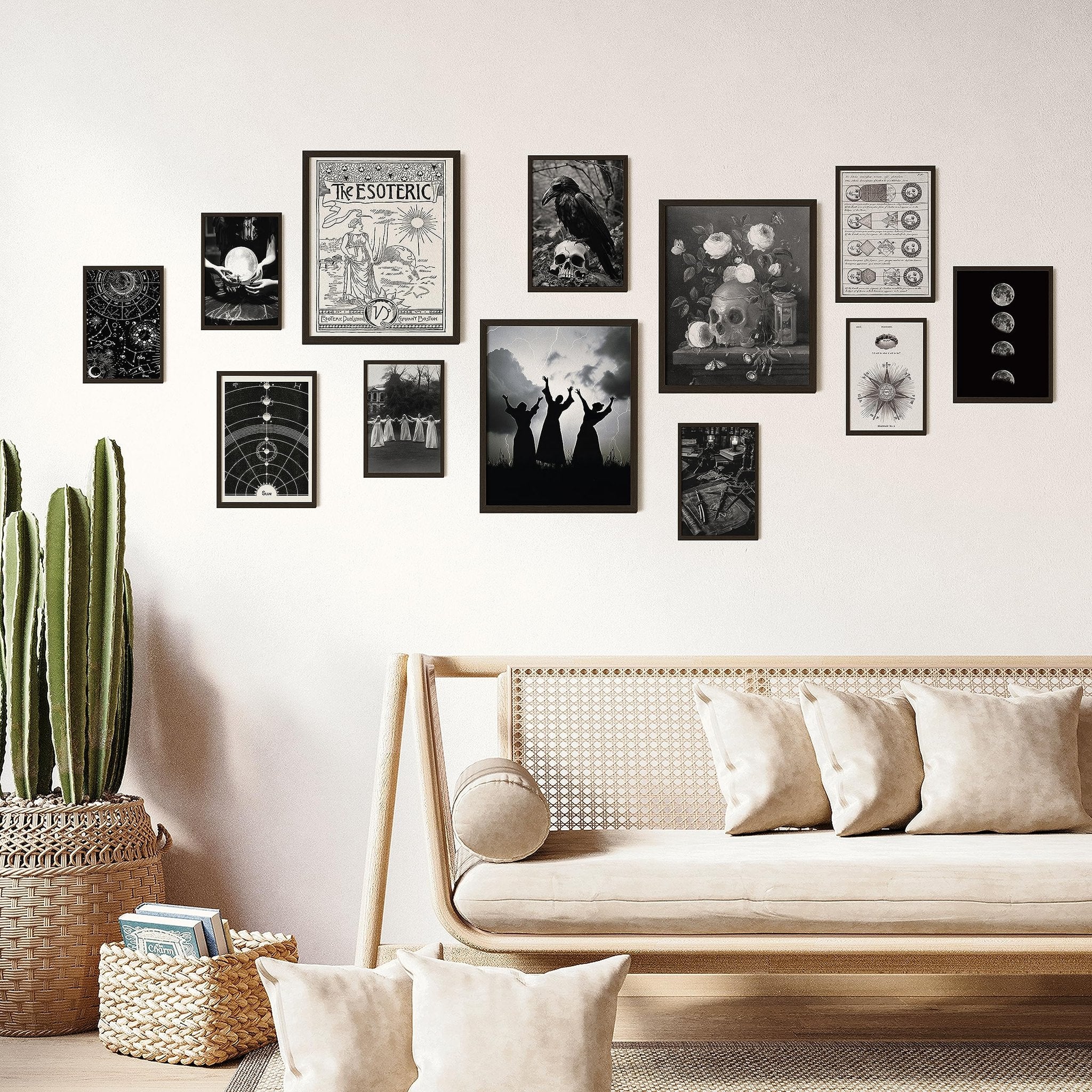 Gallery wall of 12 vintage gothic prints displayed above a sofa with a cactus and baskets