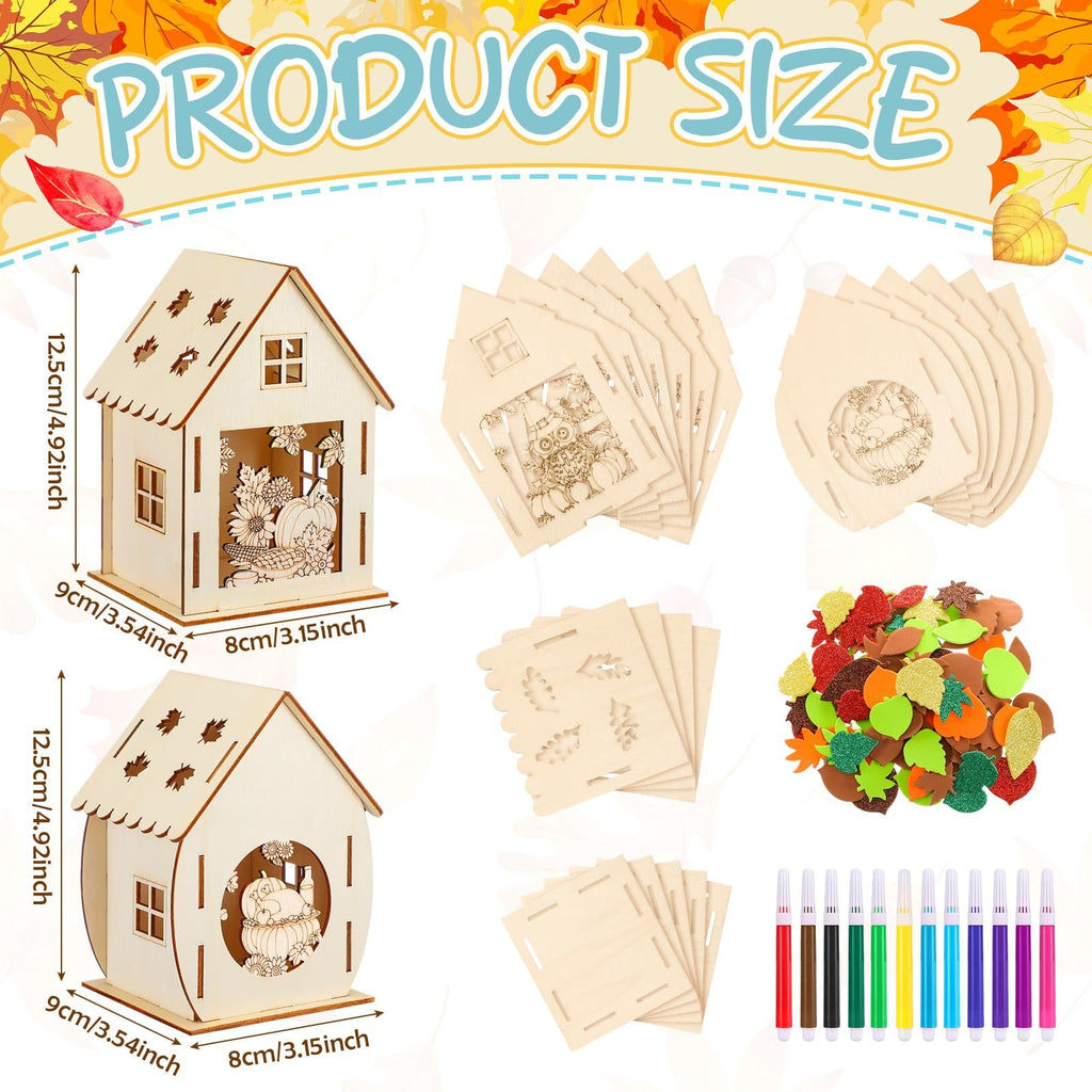 Thanksgiving wooden house craft kit components including two assembled houses, unassembled house pieces, foam stickers, and watercolor pens.