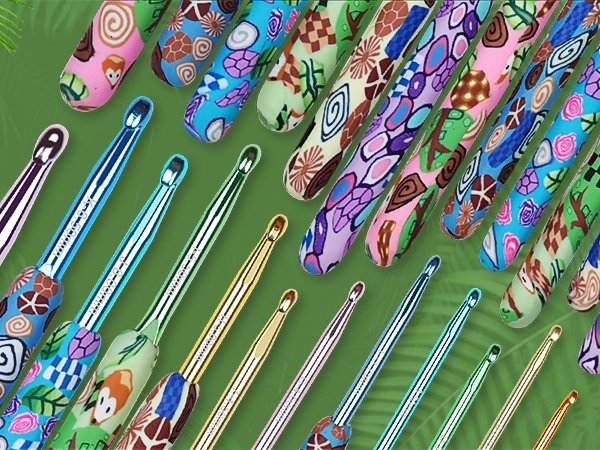 Assortment of crochet hooks with colorful animal print clay handles arranged diagonally on a green background.
