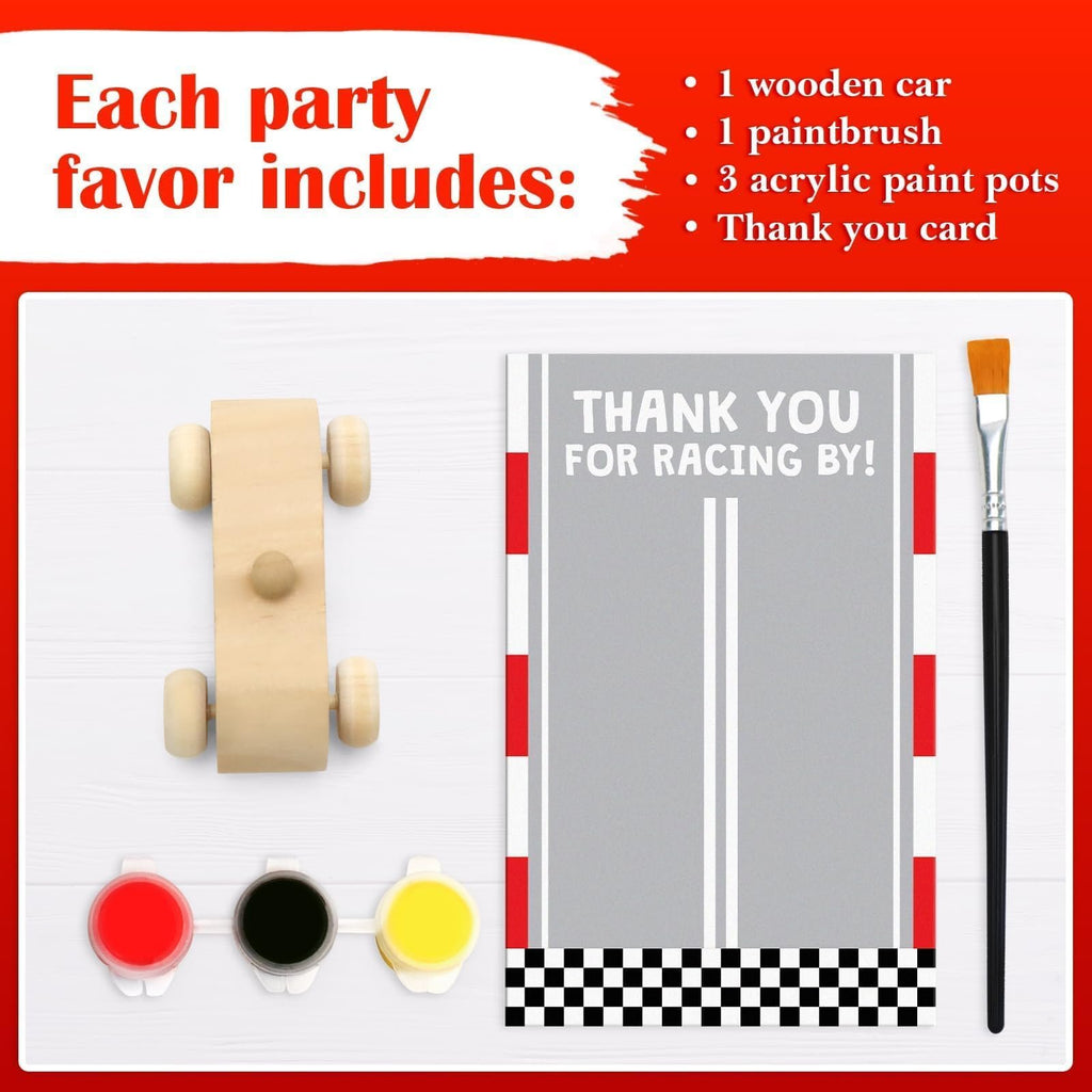 Unfinished wooden race car painting kit contents including a wooden car, paint pots, paintbrush, and thank you card.