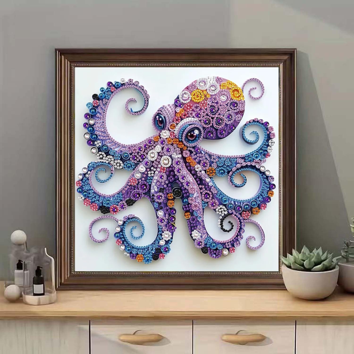 Framed 5D purple octopus diamond painting kit with crystal rhinestones, displayed on a wooden dresser.
