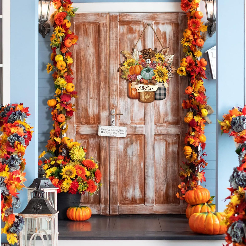 Front door decorated for fall with a hanging sign featuring pumpkins, sunflowers, and pinecones.