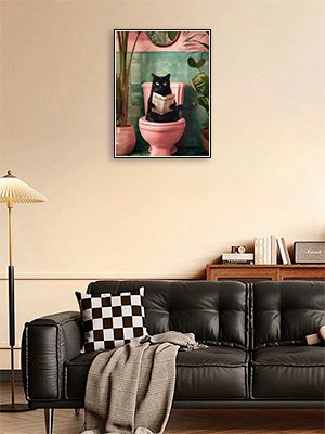 Black cat sitting on a pink toilet reading a book, surrounded by plants and a mirror