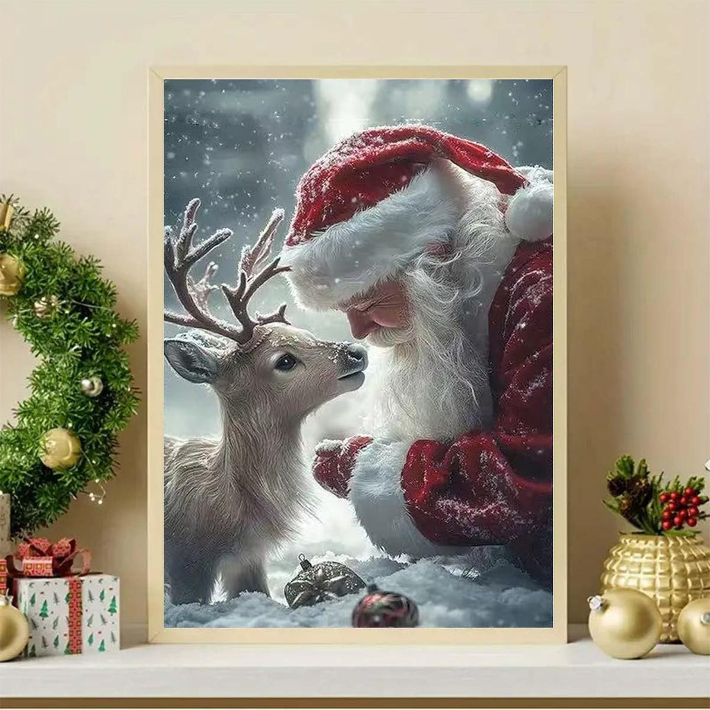 Diamond painting kit featuring Santa Claus and a fawn in a snowy forest setting, with Christmas decorations around the framed artwork.