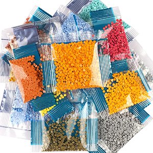 Pile of small plastic bags filled with colorful diamond painting rhinestones, top view.