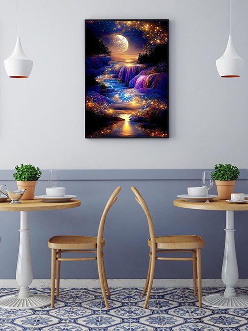 Diamond painting of a moonlit waterfall with sparkling lights, framed and hung on a wall above a table.