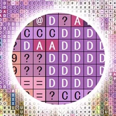 Close-up of diamond painting canvas with symbols and letters indicating color placement, within a circular frame.