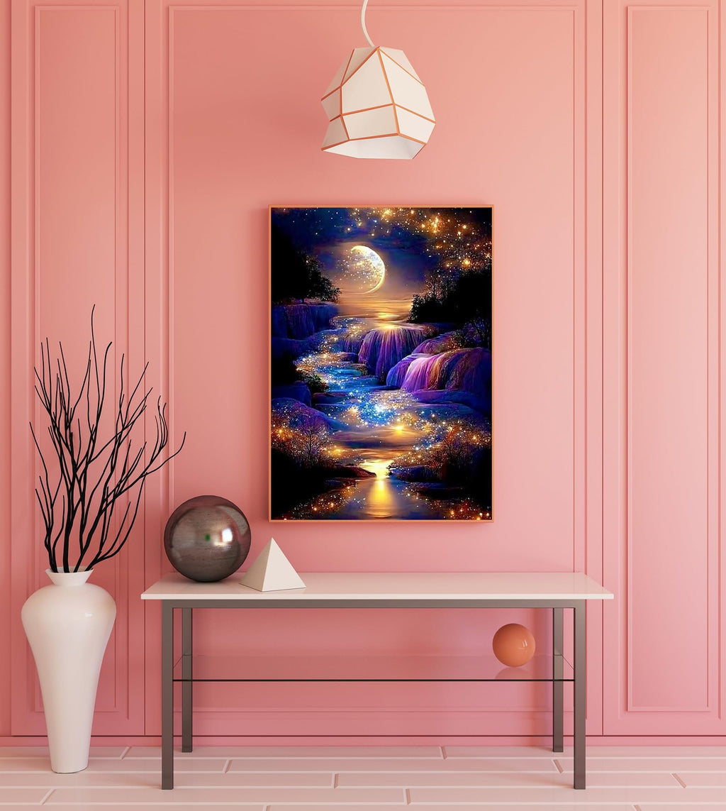 Diamond painting kit of a moonlit waterfall with sparkling lights, framed and hung on a pink wall.