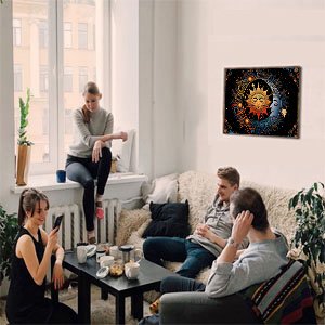 Four young adults relax in a living room with a sun and moon diamond painting hanging on the wall.
